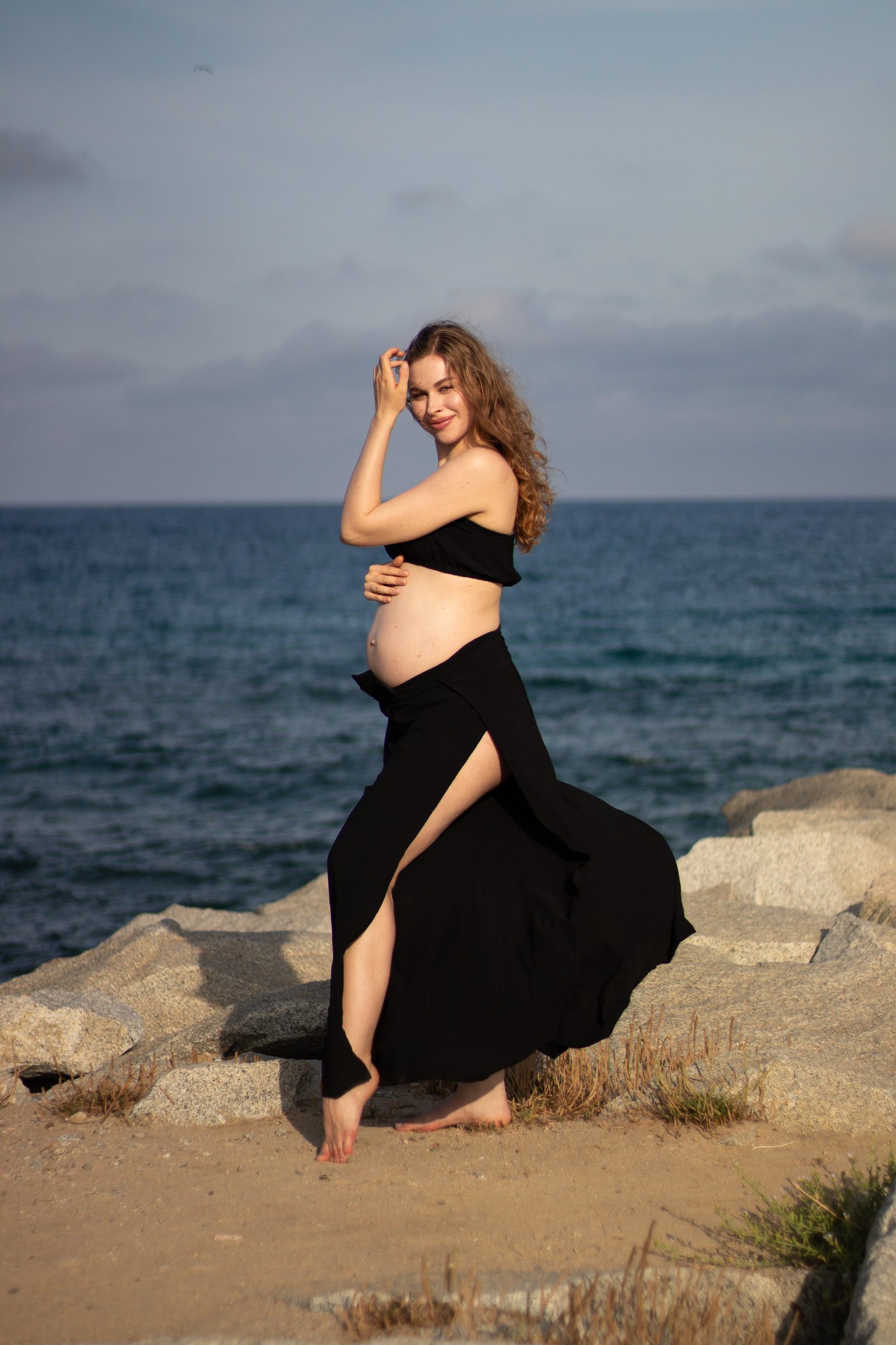 Maternity portrait by the sea