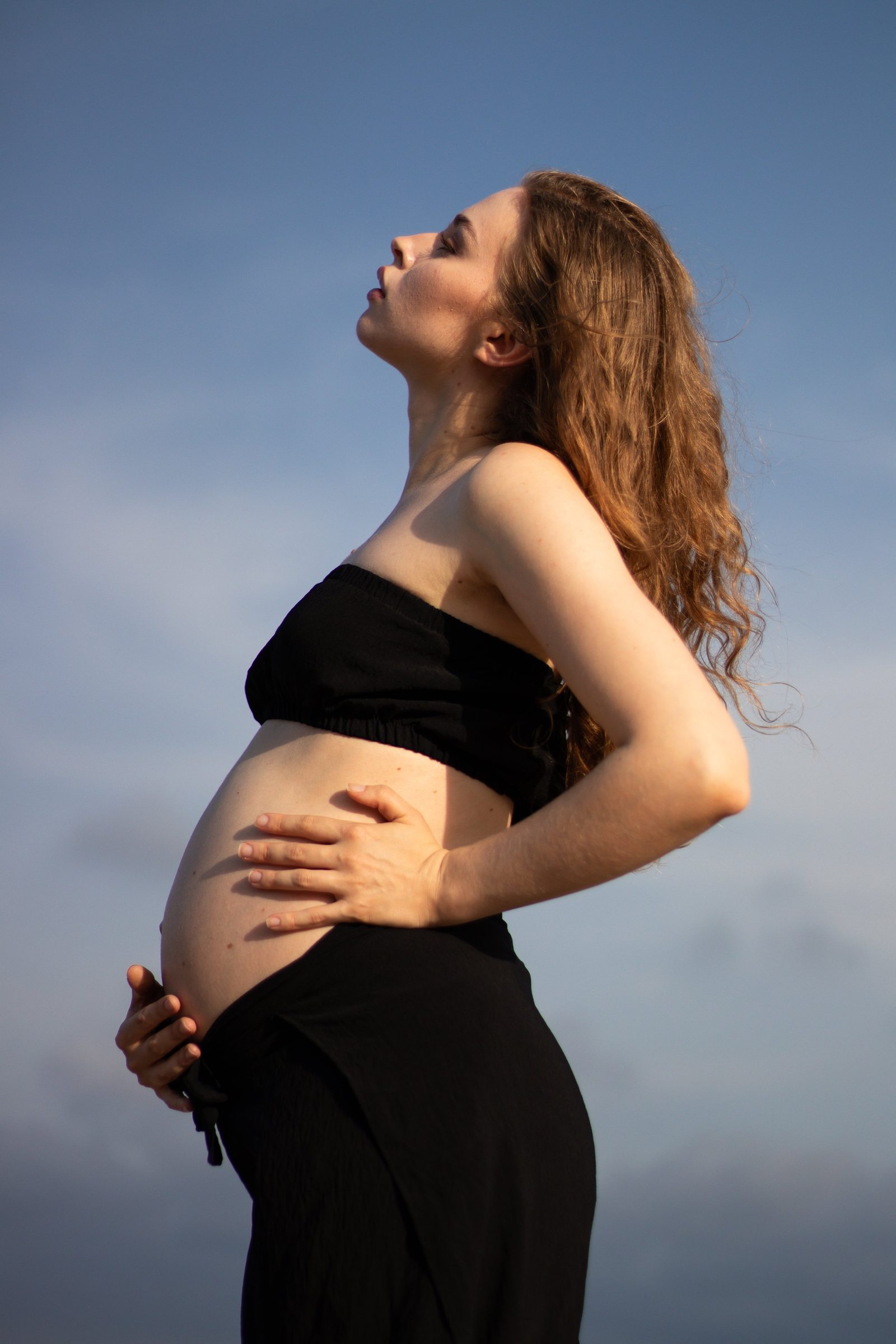 Maternity portrait against the sky