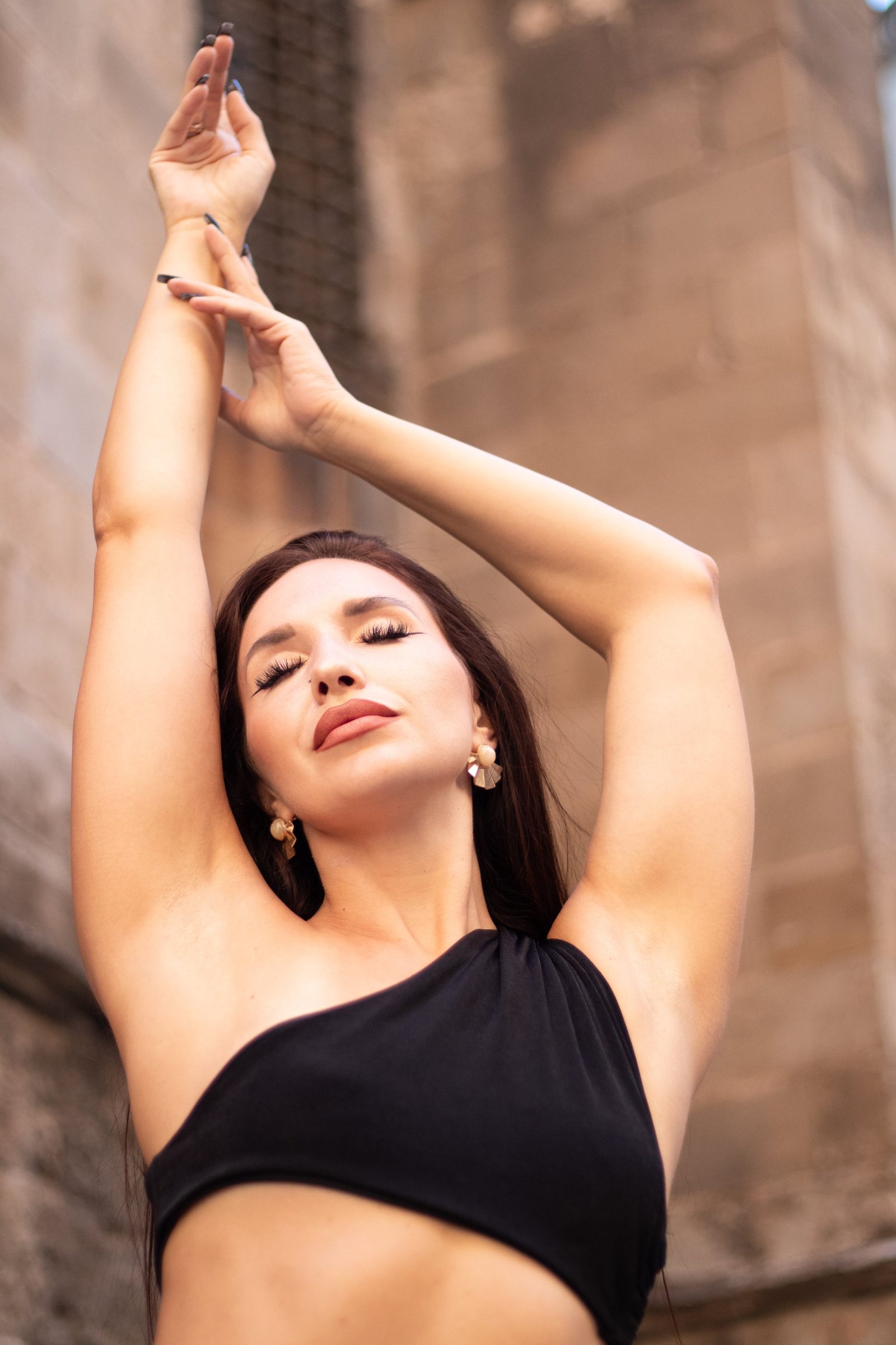 Portrait with arms raised