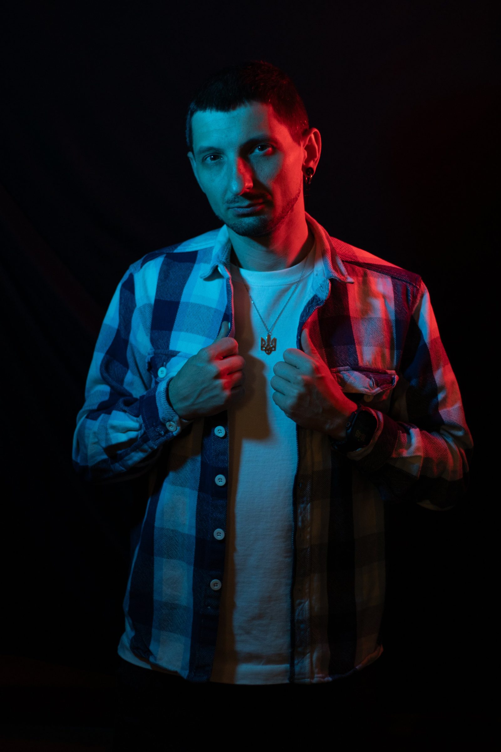 Studio portrait in a checked shirt